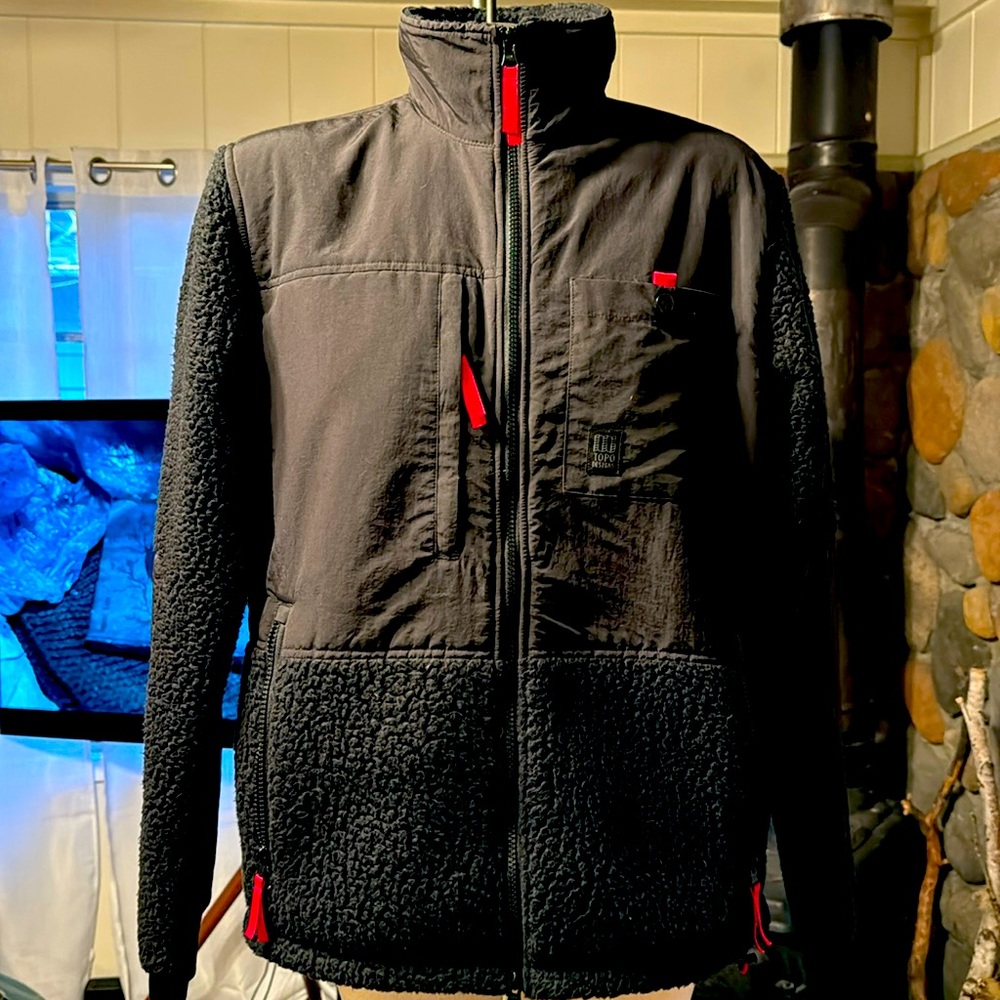 Too Designs. Men’s black fleece with red details. NWOT